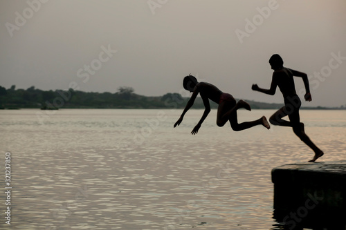 young boys in Indian playing by the river