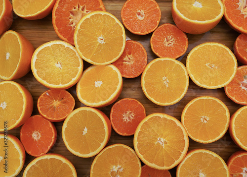  Oranges frame on the bamboo  wood board. Fresh jusy fruits photo