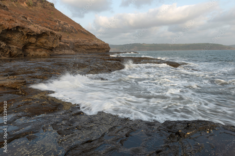Rocky coast of Harihareshwar beach, Maharashtra, India Rocky coast of Harihareshwar beach, Maharashtra, India