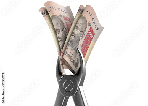 Dentist Pliers And Rupee Banknotes photo