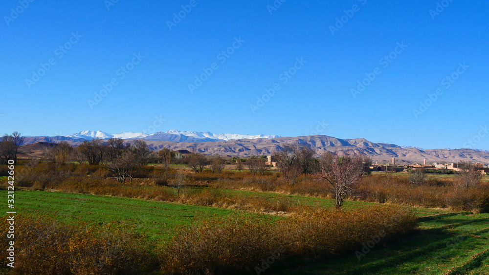 Bright landscape of Morocco, breathtaking curves of mountains, stunning combination of hills & farm land,inadvertent distribution of houses & huts, raw impression of pure nature. Bright landscape of Morocco, breathtaking curves of mountains, stunning combination of hills & farm land,inadvertent distribution of houses & huts, raw impression of pure nature.