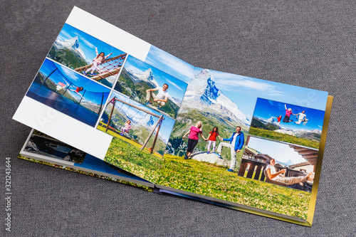 Canvastavla the photobook opened, travel in switzerland, on gray background