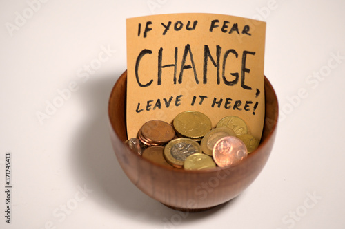 Bowl With Coins With Sign photo