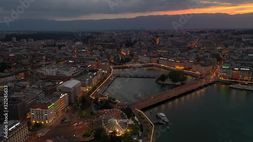 sunset night illumination geneva city riverside traffic bridge ferris wheel bay aerial panorama 4k switzerland