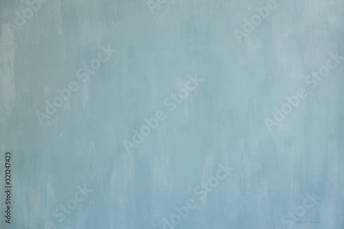 Blue texture painted acrylic wall paint. Light blue background