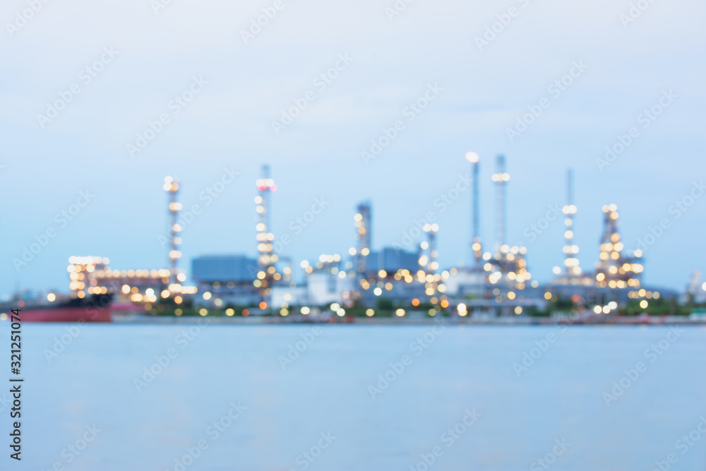 Defocus of oil refinery plant at twilight.