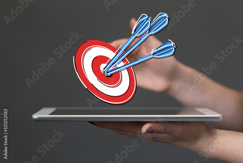 Obraz na płótnie dart target arrow hitting on bullseye which is the ultimate goal that everyone wants