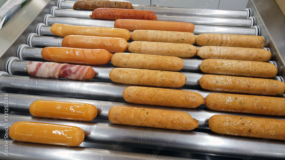 All kind of sausages in sausage rolling grill. All kind of sausages in sausage rolling grill.