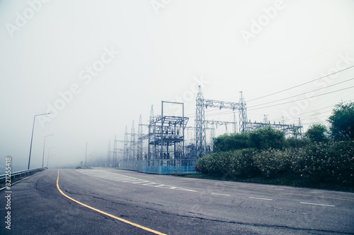 Power plant - transformation station. Multitude of cables and wires photo