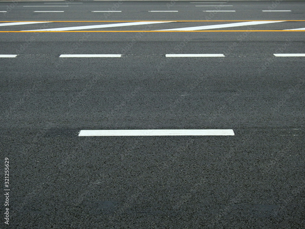 asphalt road with yellow and white line texture