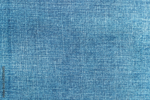 Blue color denim jeans clothes textured background