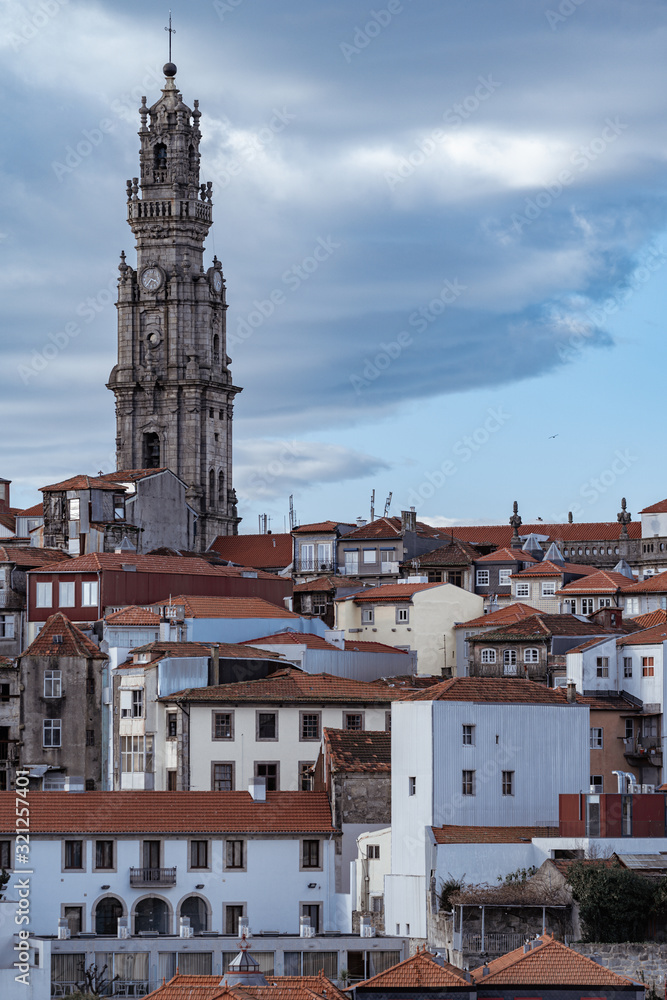 Viewpoint of the red clay rooftops and tower of the Clerigos Church (Baroque style church with bell tower) in Porto Portugal