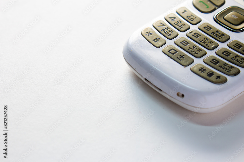 Keypad of a basic cellular phone. View of a old mobile phone with dial buttons. Keypad of a basic cellular phone. View of a old mobile phone with dial buttons.