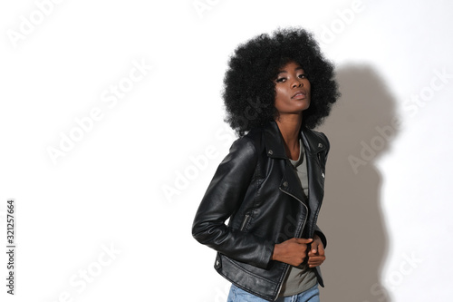 Slika na platnu High fashion afro-american model in black leather jacket isolated on white background