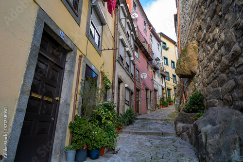 narrow street in the old town of Porto Portugal with colorful buildings