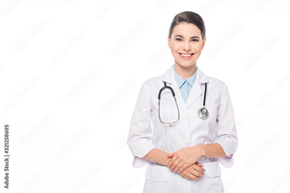 Beautiful doctor with stethoscope smiling at camera isolated on white Beautiful doctor with stethoscope smiling at camera isolated on white