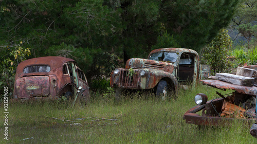 Junkyard. Oldtimer cars. Buller river Highway 6 New Zealand. Carwreck. Rusty