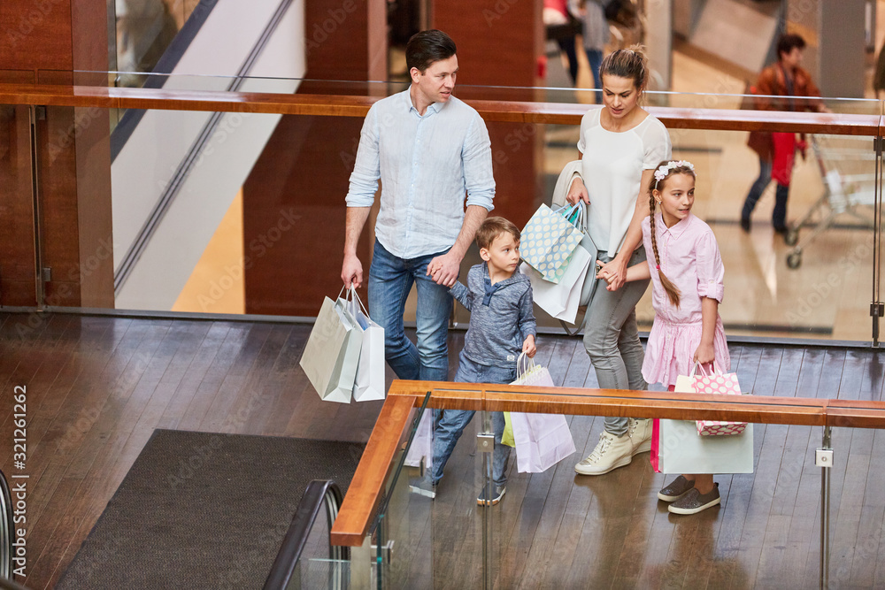 Family with two children and shopping bags Family with two children and shopping bags