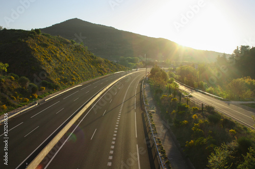autoban road with sunrise in the mountains