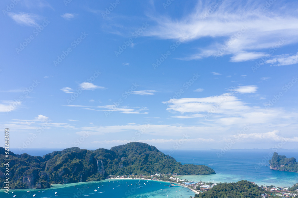 Beautiful panoramic view over Tonsai and Dalum Beach. Green jungles and hot stones on the bright sun of tropical island and the mountains in Andaman Sea. Phi Phi Viewpoint, Krabi, Thailand