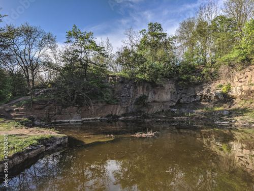 beautiful landscape of a waterfall in granite stones in Sofievka park