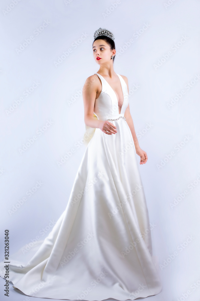 Young shocked bride turning around isolated on gray background. Copy space Young shocked bride turning around isolated on gray background. Copy space