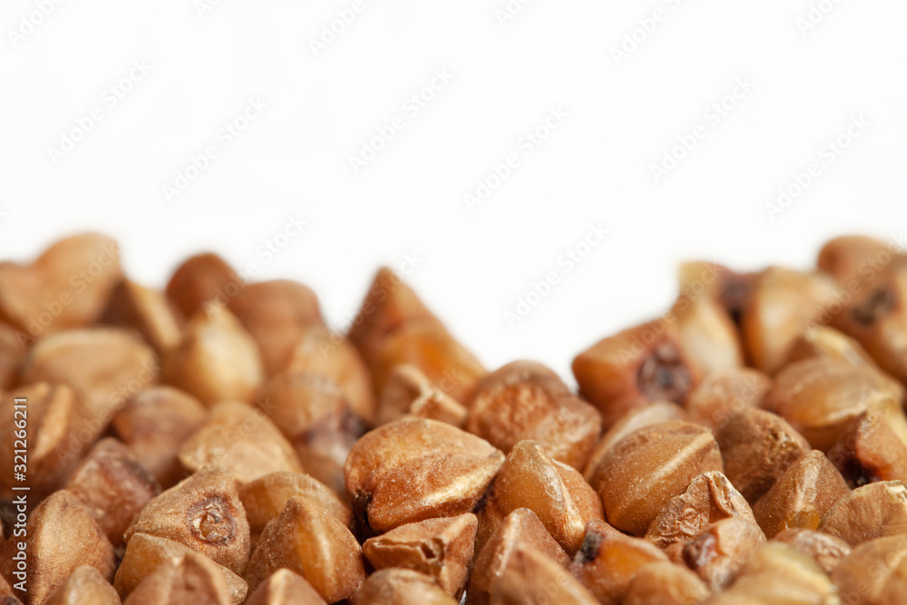 Healthy dried buckwheat grains isolated white background Healthy dried buckwheat grains isolated white background