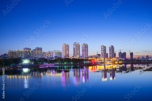 The city by the river is at night © zhengzaishanchu