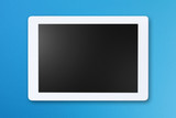 Modern digital tablet isolated on blue background