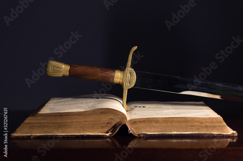 One Hundred Fifty Year Old Bible with Sword photo