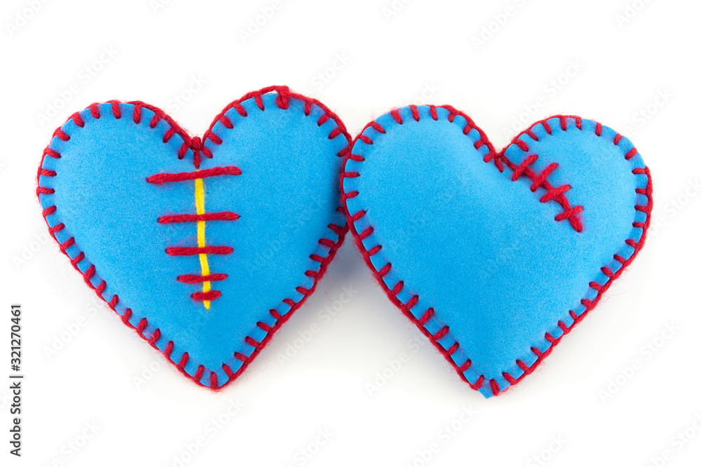 Hand stitched textile hearts isolated on white Hand stitched textile hearts isolated on white