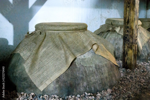 Kvevri - ancient clay vessels for aging wine in family winery in Areni village