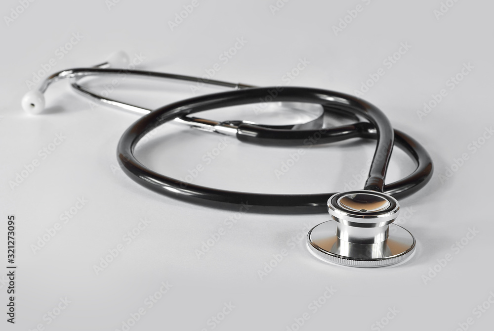Stethoscope on a white background. Medical equipment on the table. Stethoscope on a white background. Medical equipment on the table.