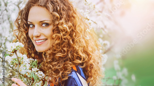 Attractive young woman in sunlight in nature