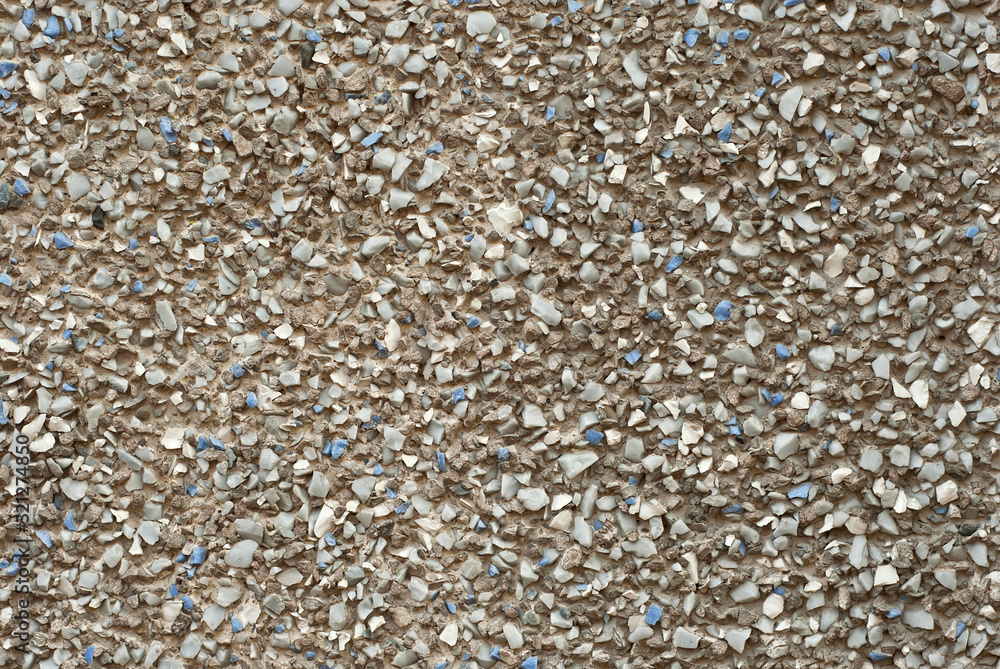 The texture of the wall is made of small blue and white stones. The texture of the wall is made of small blue and white stones.