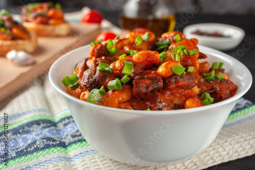 Braised white beans with mushrooms and tomatoes in spicy sauce