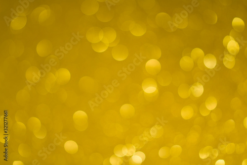 Festive background with bright gold lights