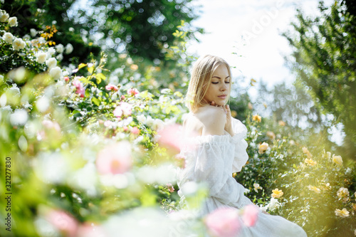 girl in a white dress among flowers