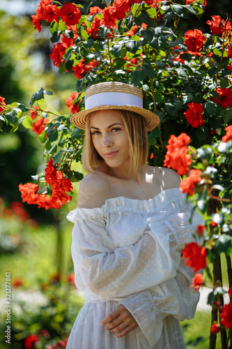 girl in a white dress among flowers