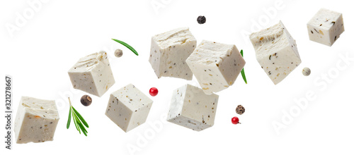 Photos Falling feta cubes with herbs isolated on white background