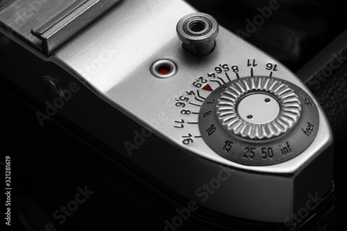 Obraz na plátně Depth of field scale and shutter release button of old film camera