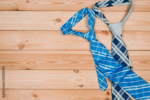 accessories for men. colorful ties on a wooden background. concept of happy father's day or shoppig photo