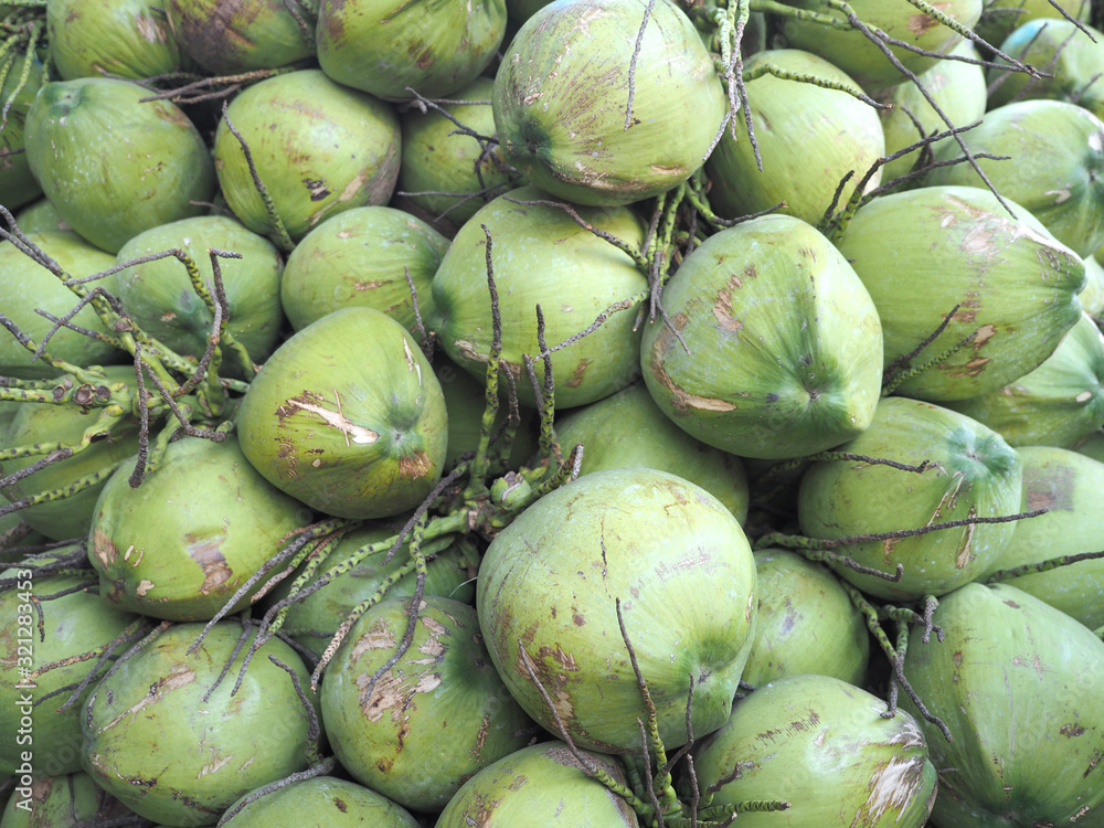 Full frame shot of fresh coconut for sale in local market. coconut background, farmer market. Full frame shot of fresh coconut for sale in local market. coconut background, farmer market.