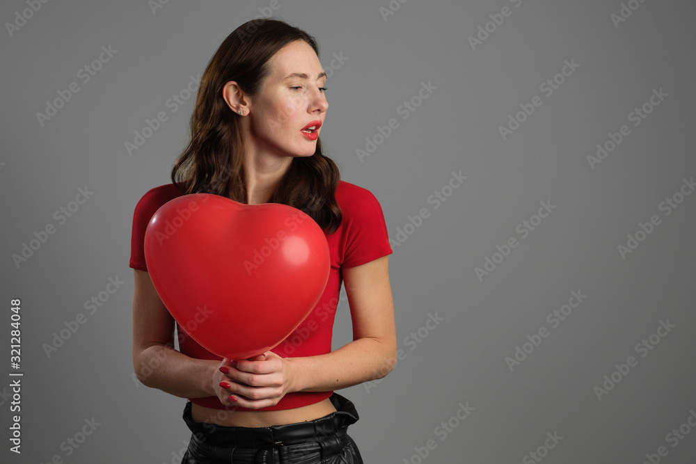 Beautyful emotional brunette girl with red balloon Beautyful emotional brunette girl with red balloon