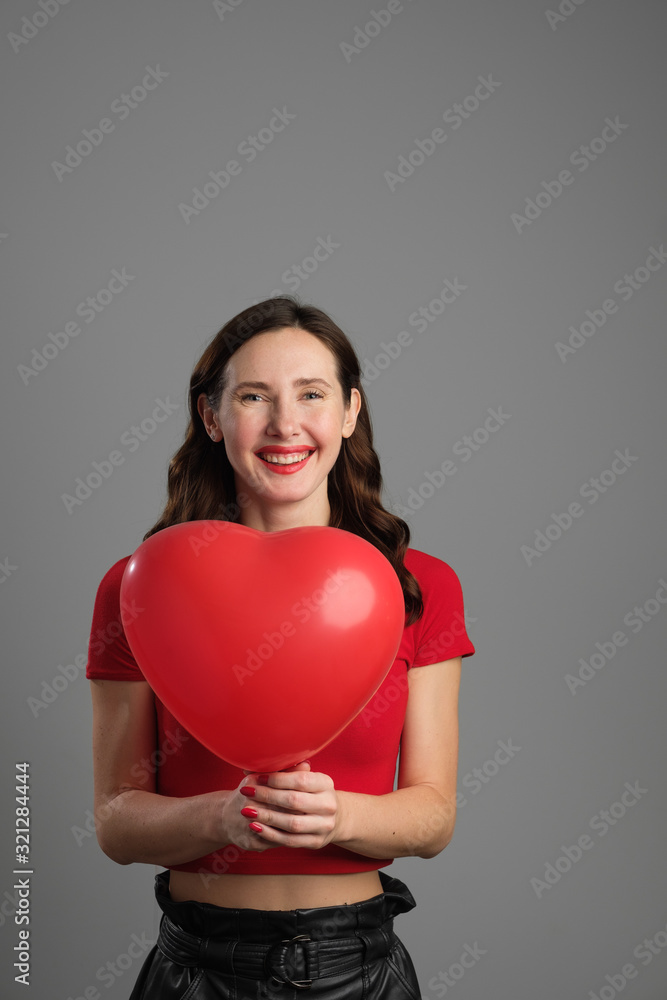 Beautyful emotional brunette girl with red balloon Beautyful emotional brunette girl with red balloon