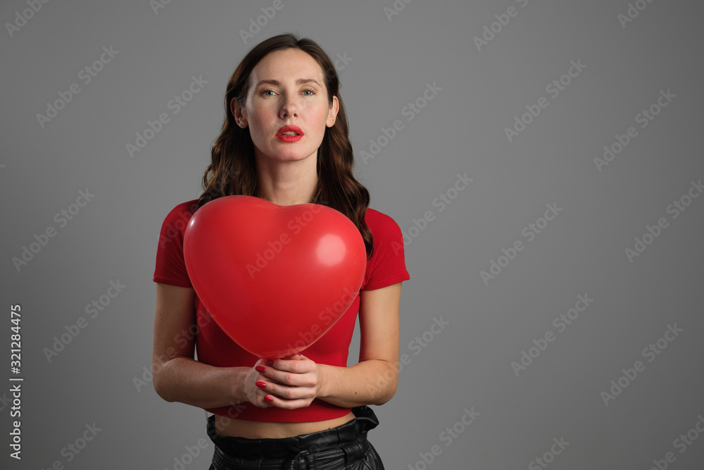 Beautyful emotional brunette girl with red balloon Beautyful emotional brunette girl with red balloon