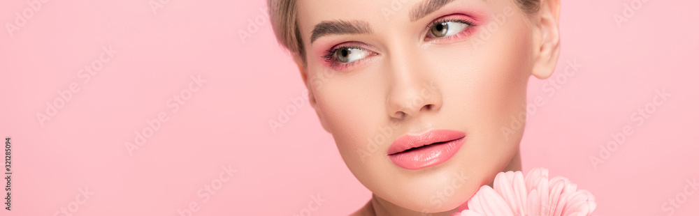 panoramic shot of beautiful tender girl with pink flower, isolated on pink panoramic shot of beautiful tender girl with pink flower, isolated on pink
