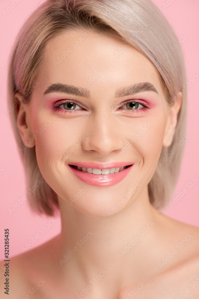 cheerful attractive girl with pink makeup, isolated on pink cheerful attractive girl with pink makeup, isolated on pink