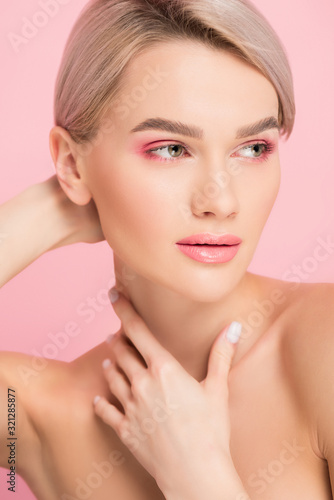 beautiful naked girl with pink makeup  isolated on pink