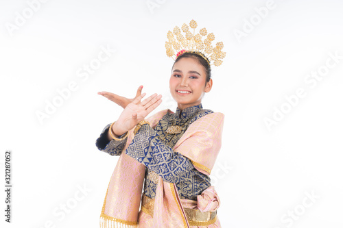 A beautiful Malaysian traditional female dancer wearing traditional dance outfit. Half length portrait isolated in white. Landscape orientation. photo